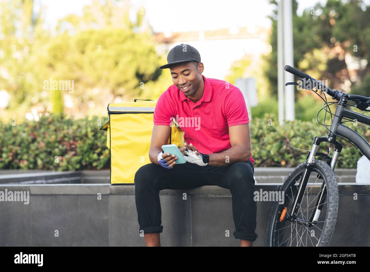 Smiling african man courier food hi-res stock photography and images ...