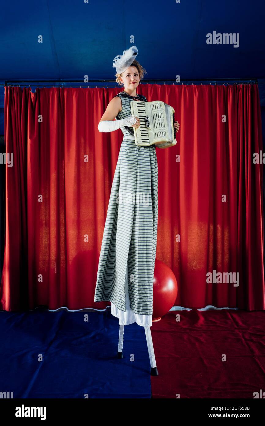 Woman standing on stilts hires stock photography and images Alamy
