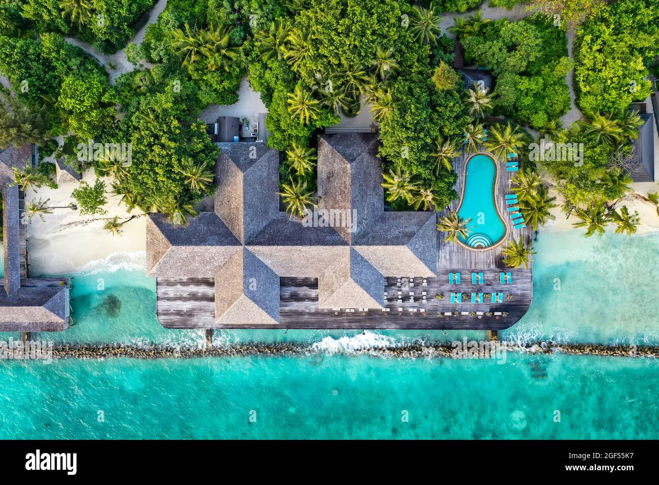 Maldives, Lhaviyani Atoll, Kuredu, Aerial view of coastal tourist resort with outdoor swimming pool Stock Photo