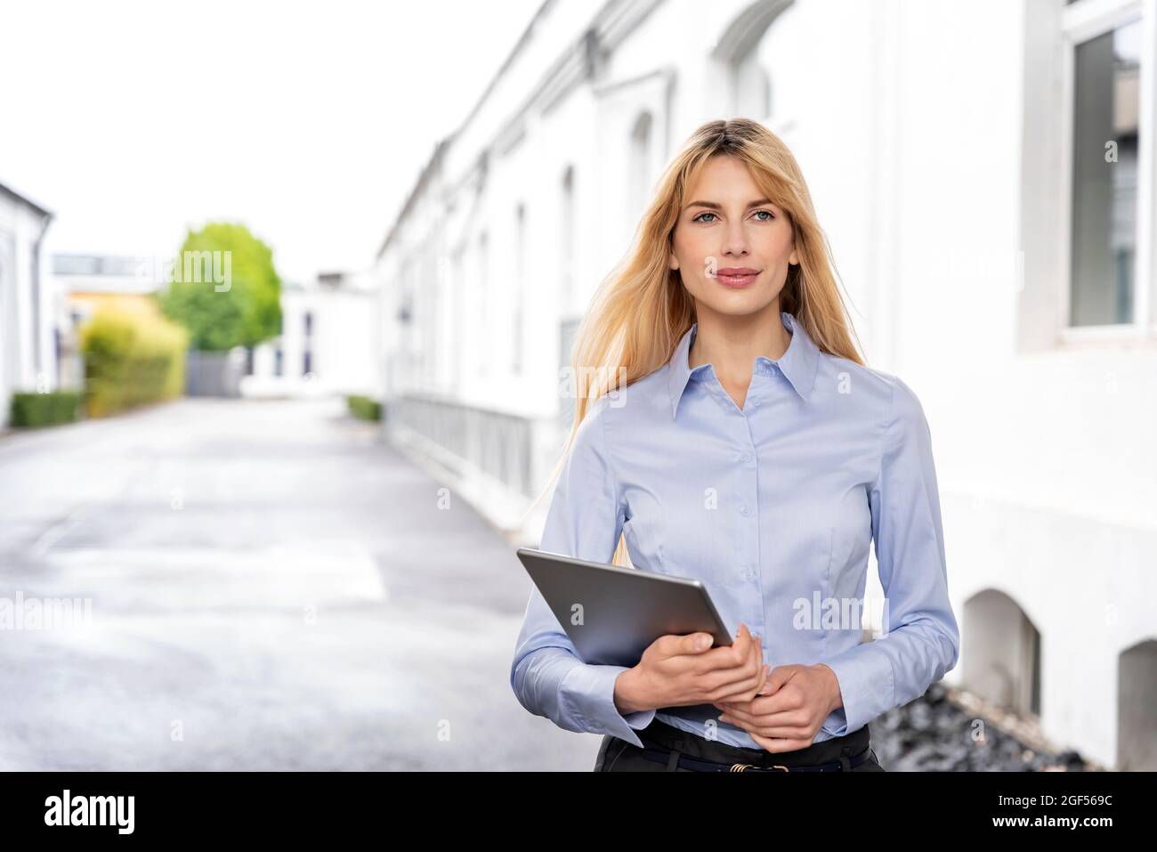 Female professional holding digital tablet Stock Photo
