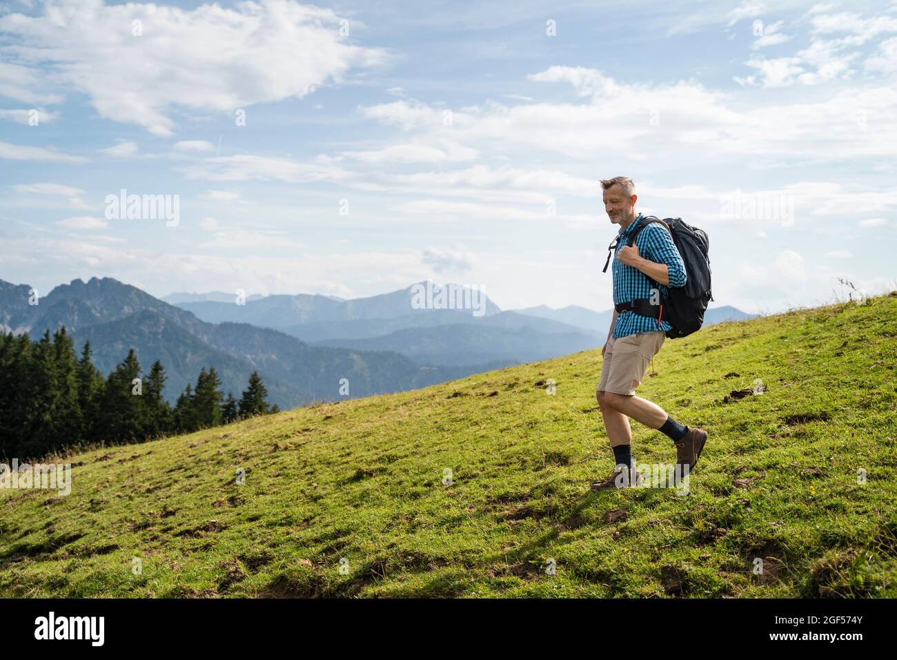 Man walking backpack male hiking hi-res stock photography and images ...
