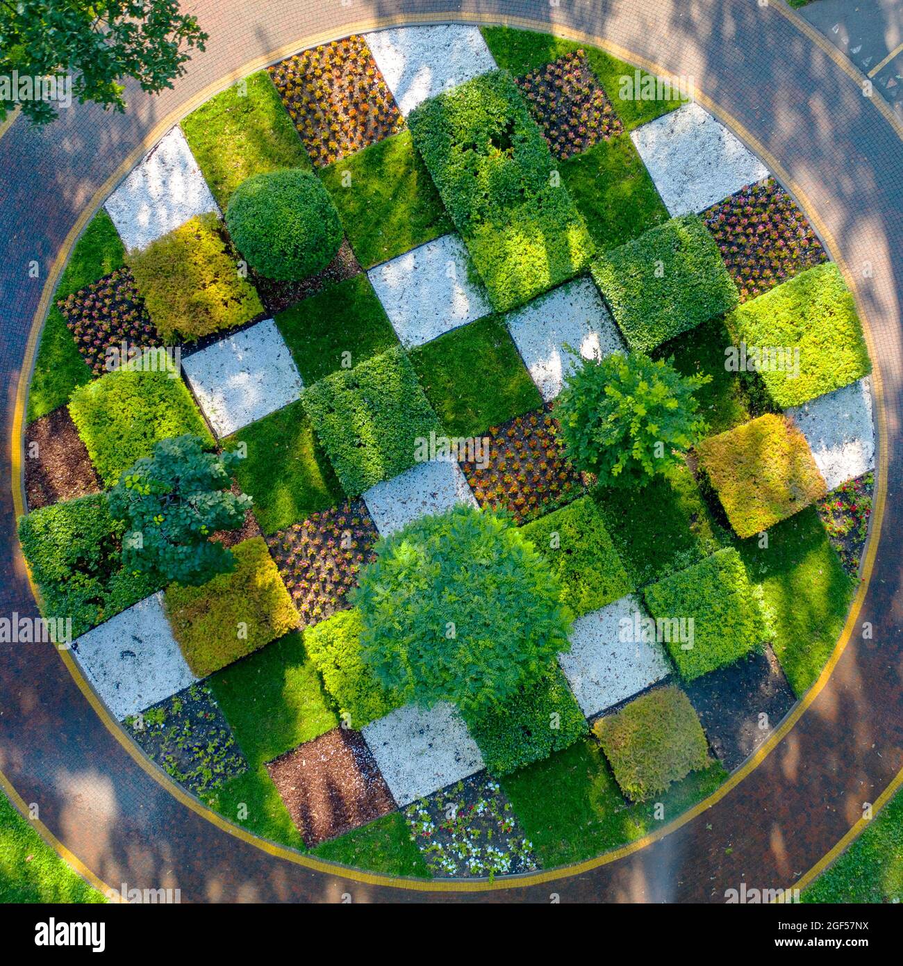 Topiary flower bed with trees and shrubs trimmed into geometric shapes