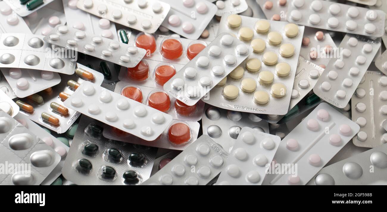 Large range of medicines. Plates with various pills and capsules 