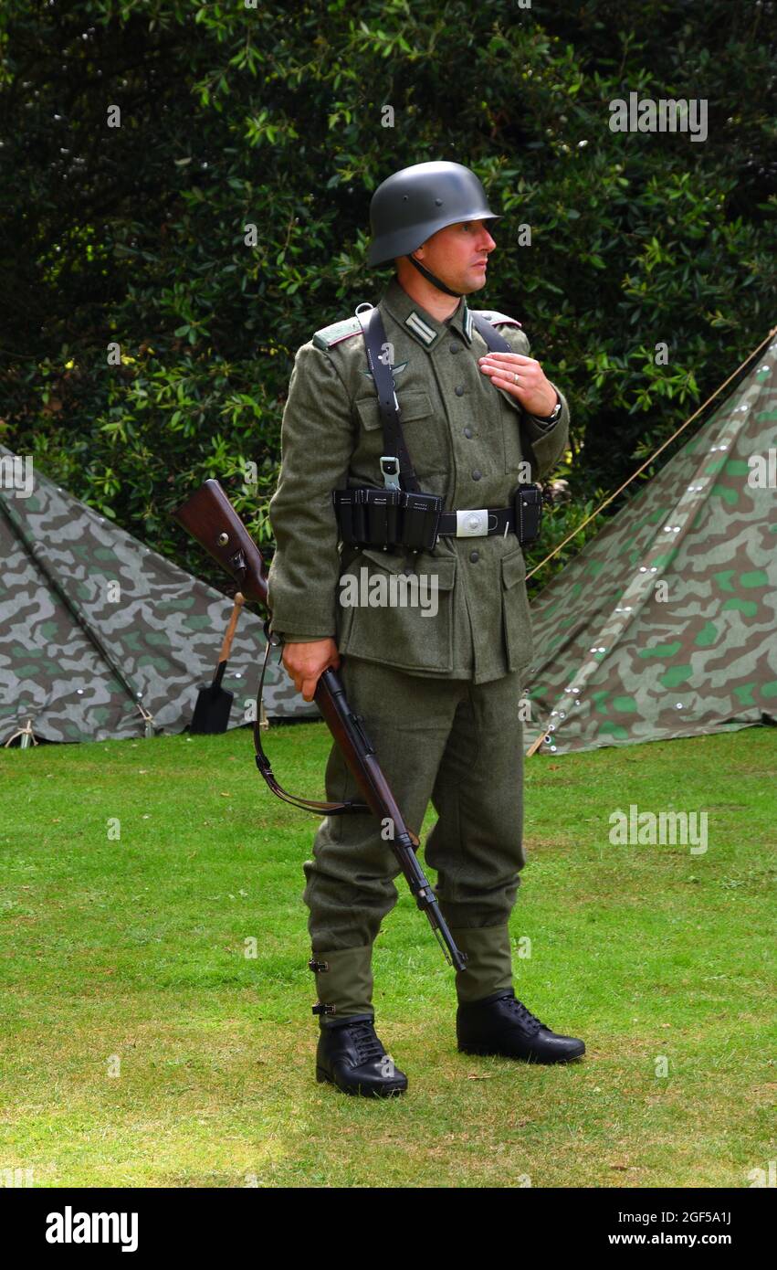 Infantryman from reenactment group in WW2  German uniform with  Mauser Rifle. Stock Photo