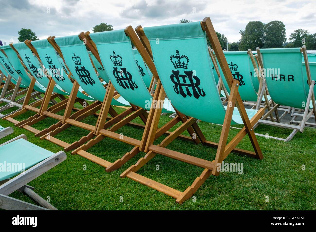 Traditional wooden deck-chairs in the Stewards Enclosure at Henley Royal Regatta 2021 on the River Thames Stock Photo