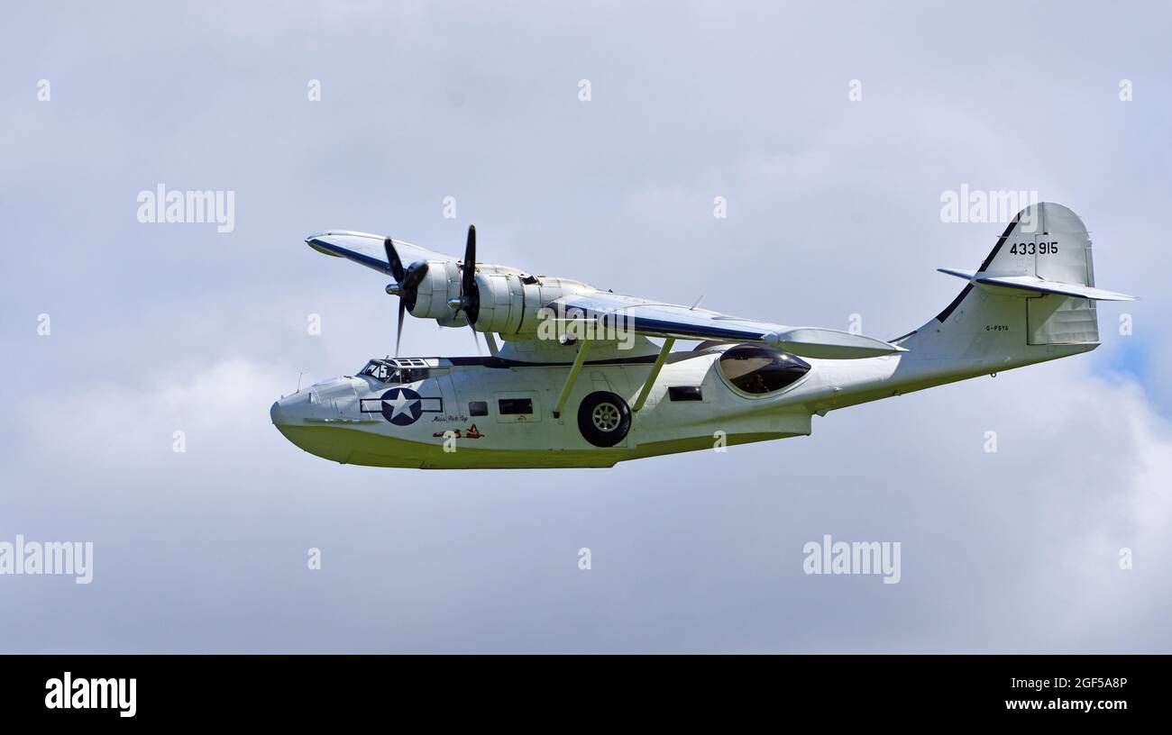 Vintage  PBY-5A Catalina “Miss Pick Up” (G-PBYA) Flying Boat  in Flight. Stock Photo