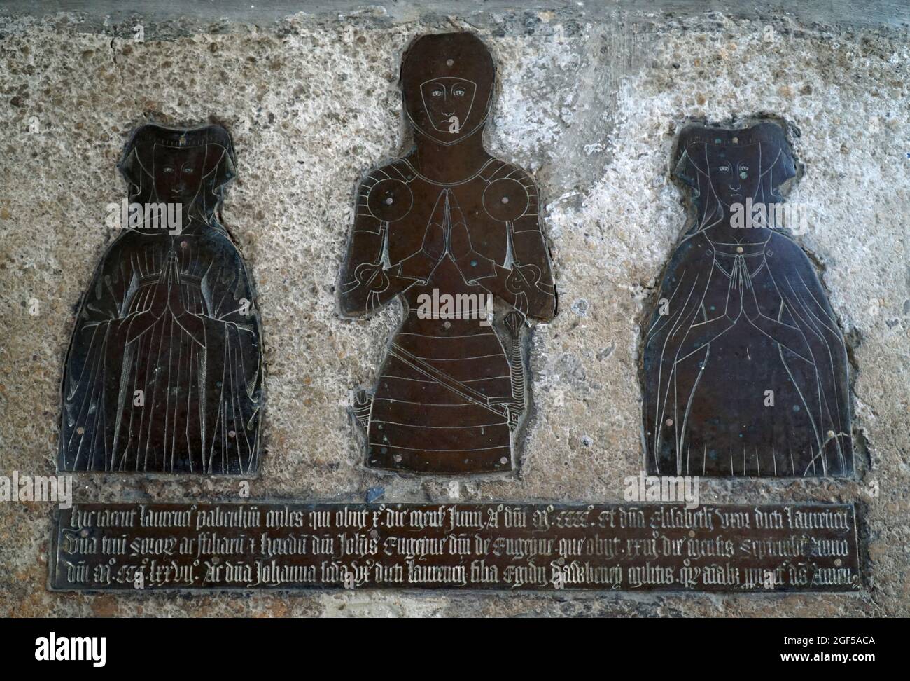 Church Brass of Sir Laurence Panham 1400 with 2 female figures. Stock Photo