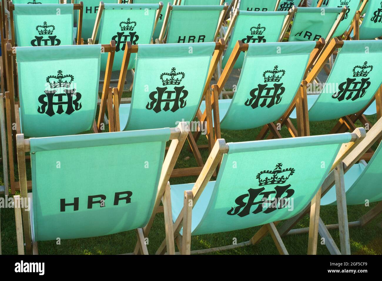 Traditional wooden deck-chairs in the Stewards Enclosure at Henley Royal Regatta 2021 on the River Thames Stock Photo