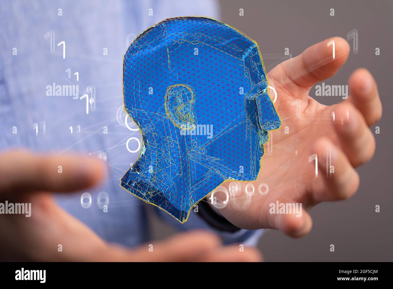 Man holding an abstract polygonal 3D human head Stock Photo