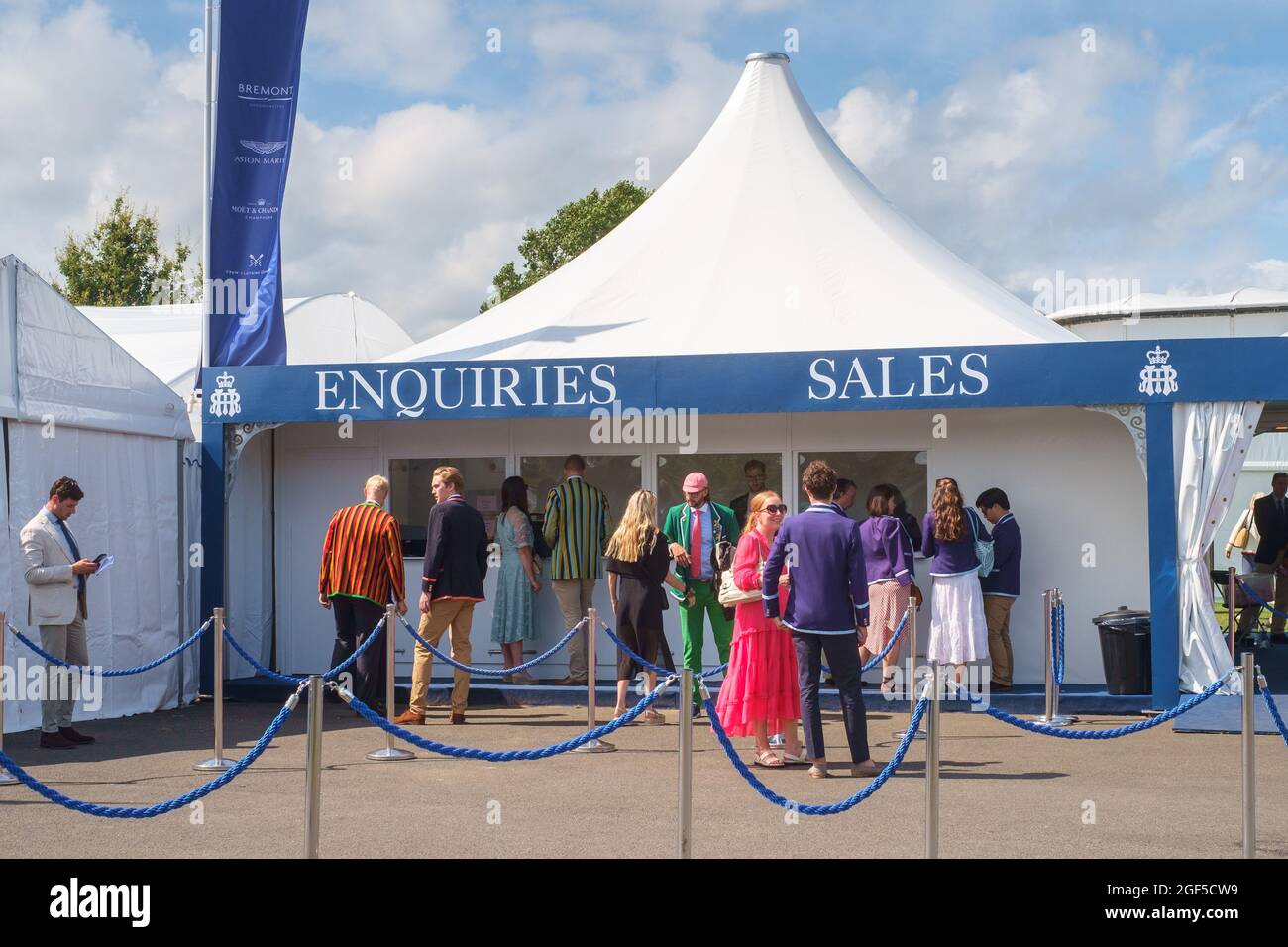 Smartly dressed spectators queue for tickets at Henley Royal Regatta 2021 on the River Thames Stock Photo
