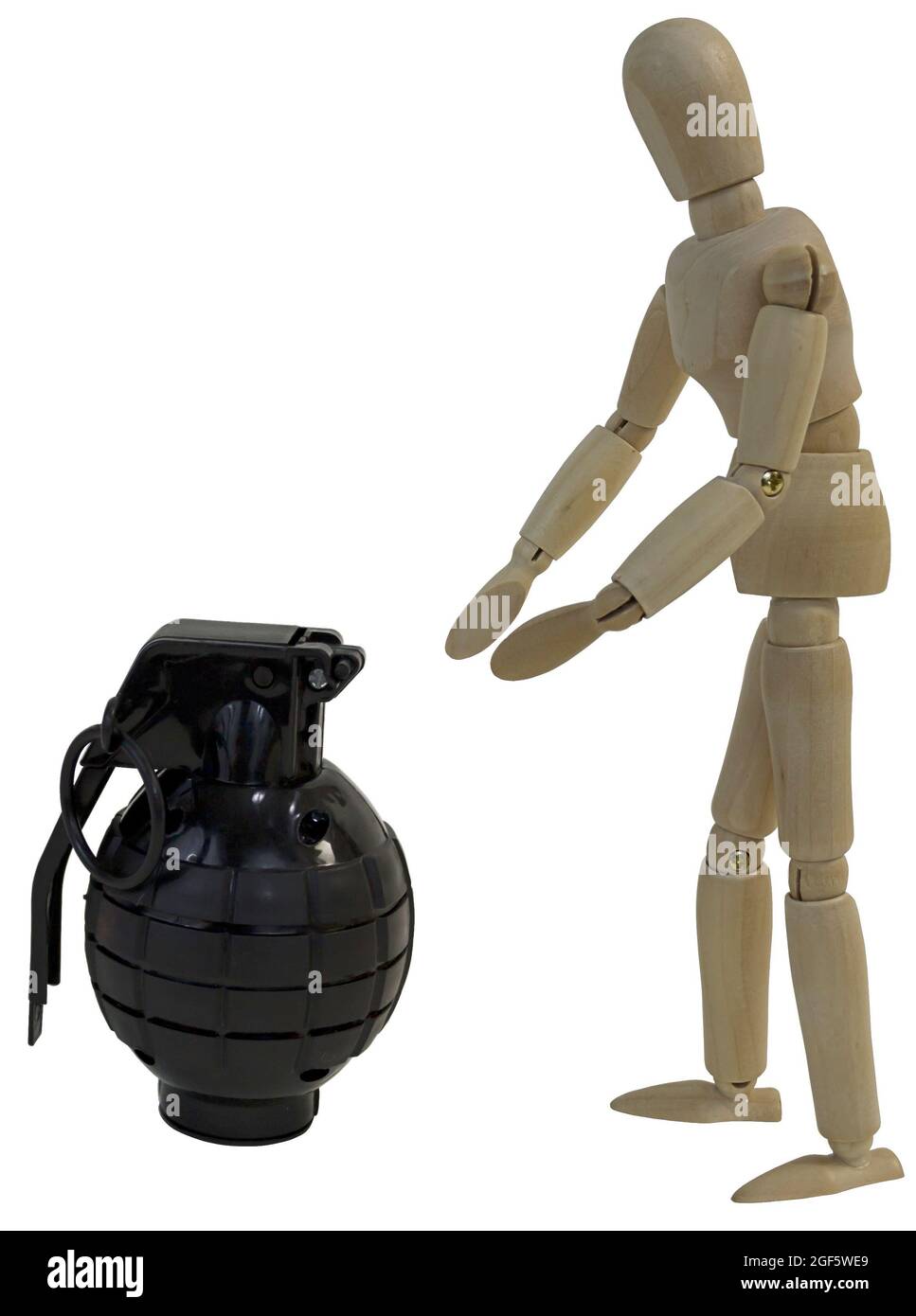 Grabbing for a black grenade Stock Photo