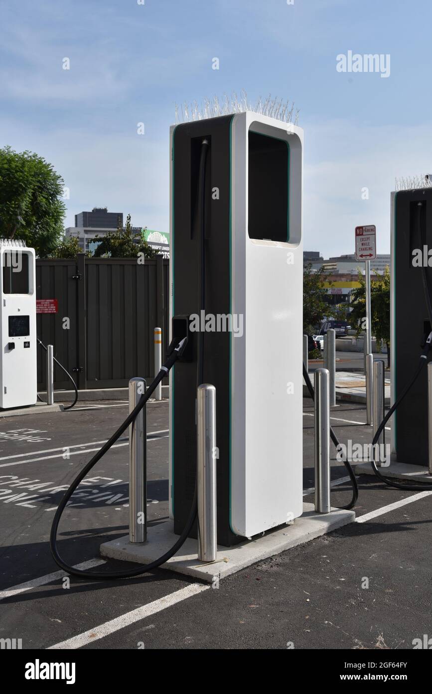 An electric vehicle charging station in a parking lot in the city Stock Photo
