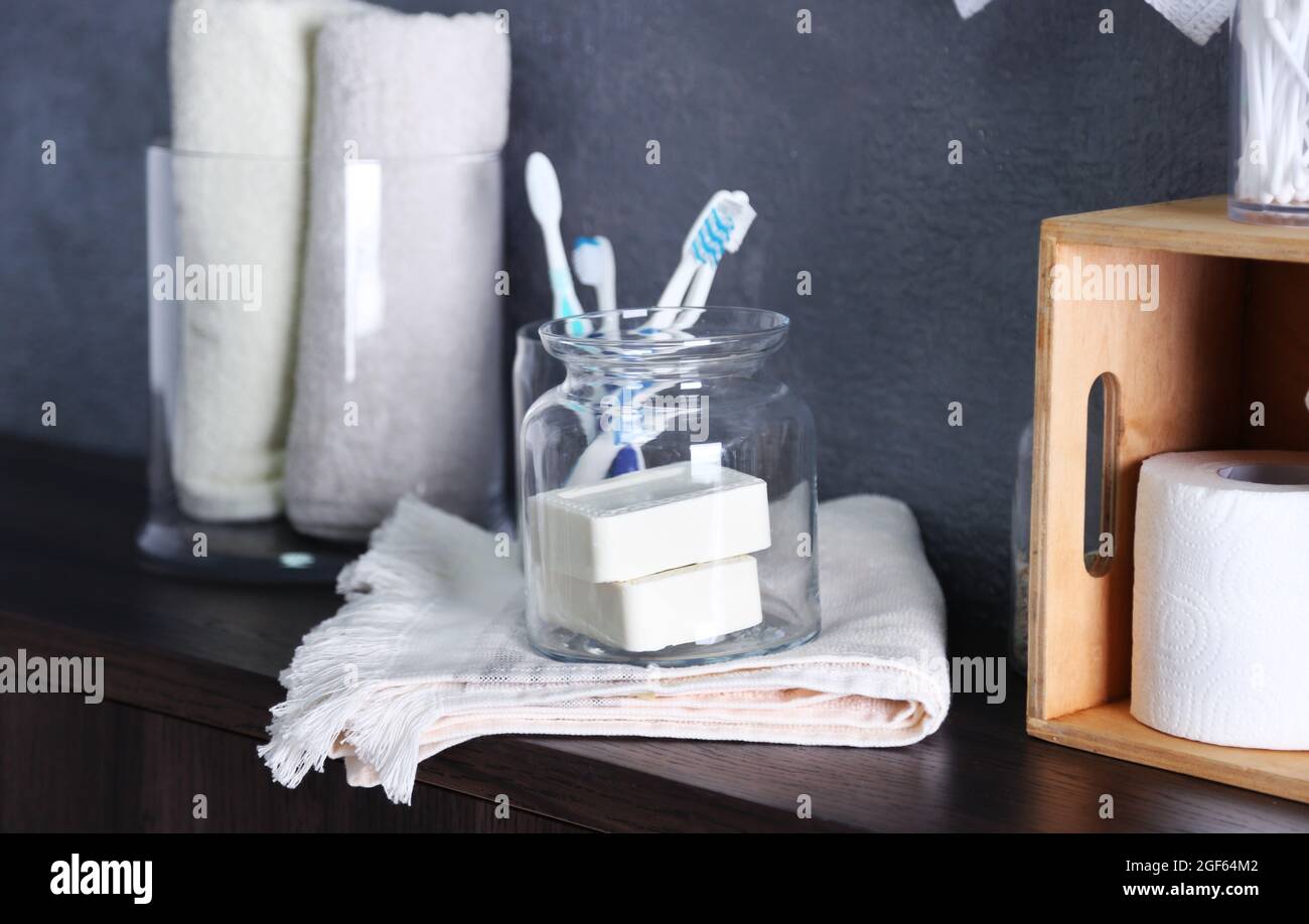 Bath accessories on grey wall background Stock Photo - Alamy