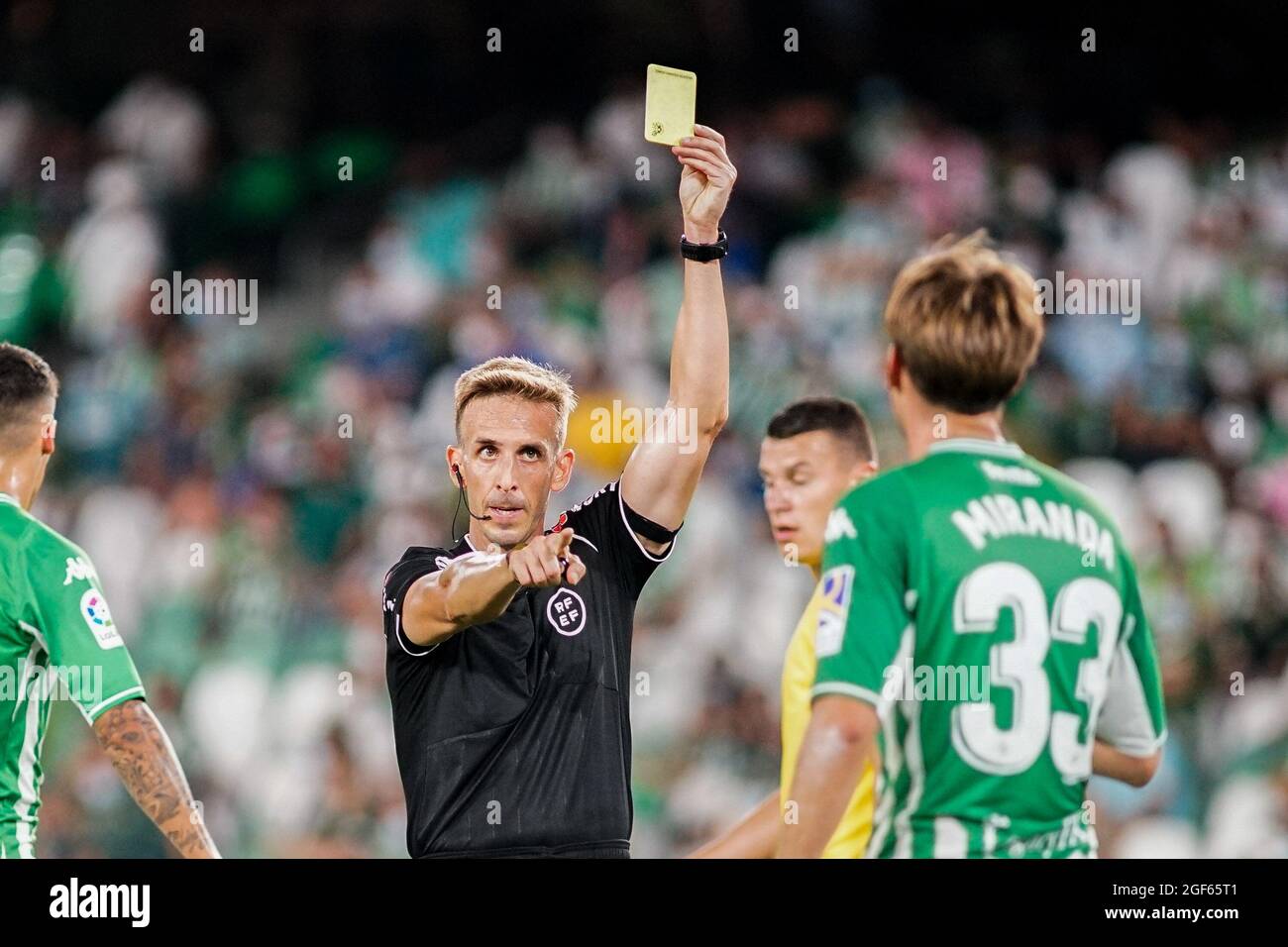Seville, Spain. 20th Aug, 2021. Referee Valentin Pizarro Gome displays a yellow card during the La Liga Santander 2021/2022 soccer match between Real Betis Balompie and Cadiz CF at Benito Villamarin Stadium in Seville. (Final Score; Real Betis 1:1 Cadiz CF) Credit: SOPA Images Limited/Alamy Live News Stock Photo