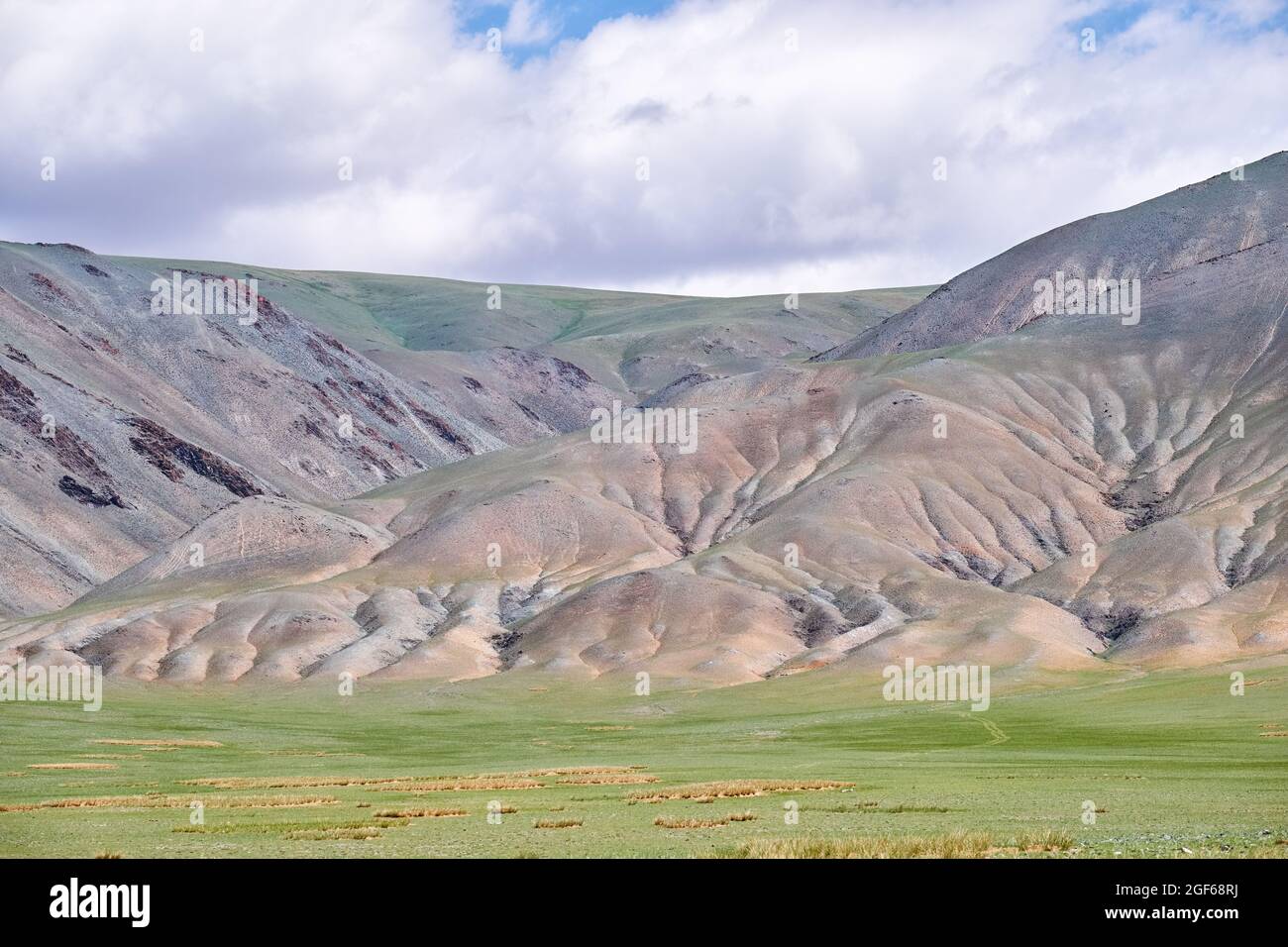 Mongolian mountain natural landscapes with eroded foothill slopes near lake Tolbo-Nuur in north Mongolia. Stock Photo