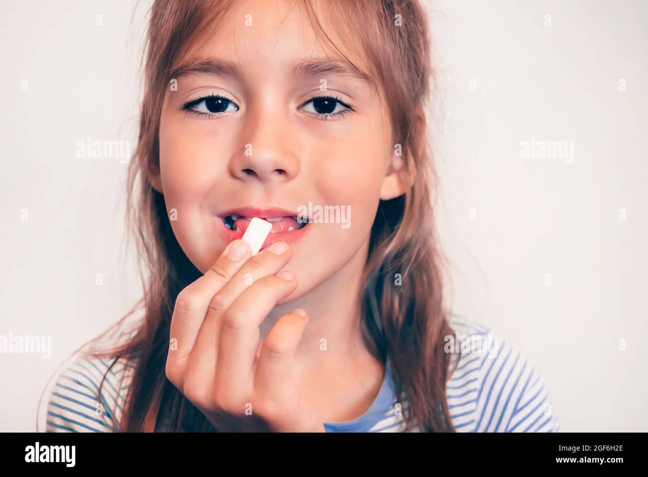 Young funny girl with chewing gum. fresh breath. Bad breath. brush up