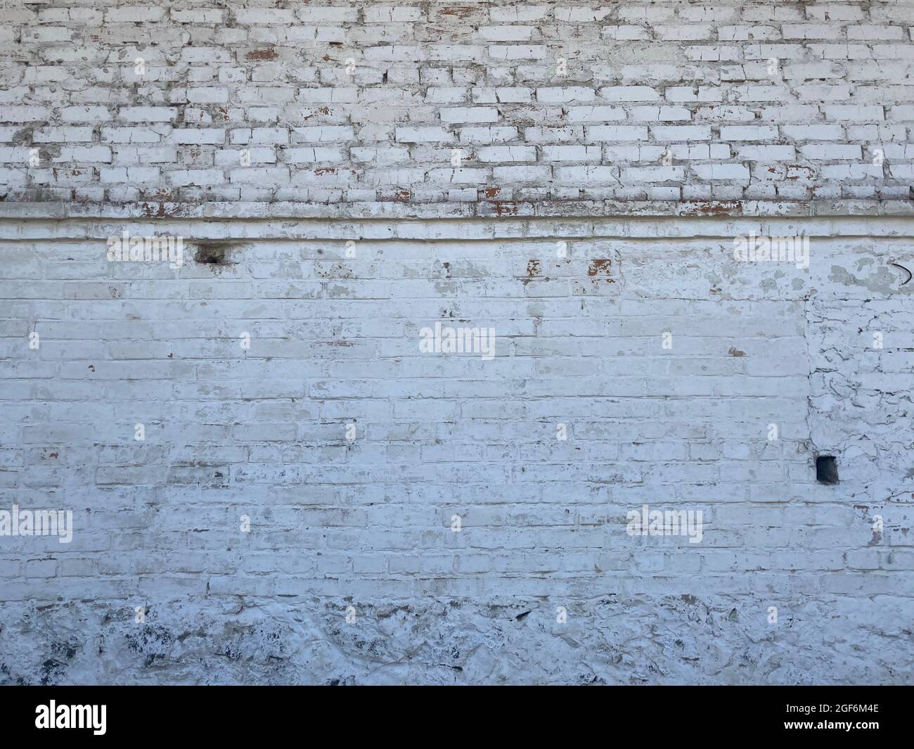 White brick wall texture. Wall background texture pattern backdrop white. Old concrete wall texture background. Stock Photo