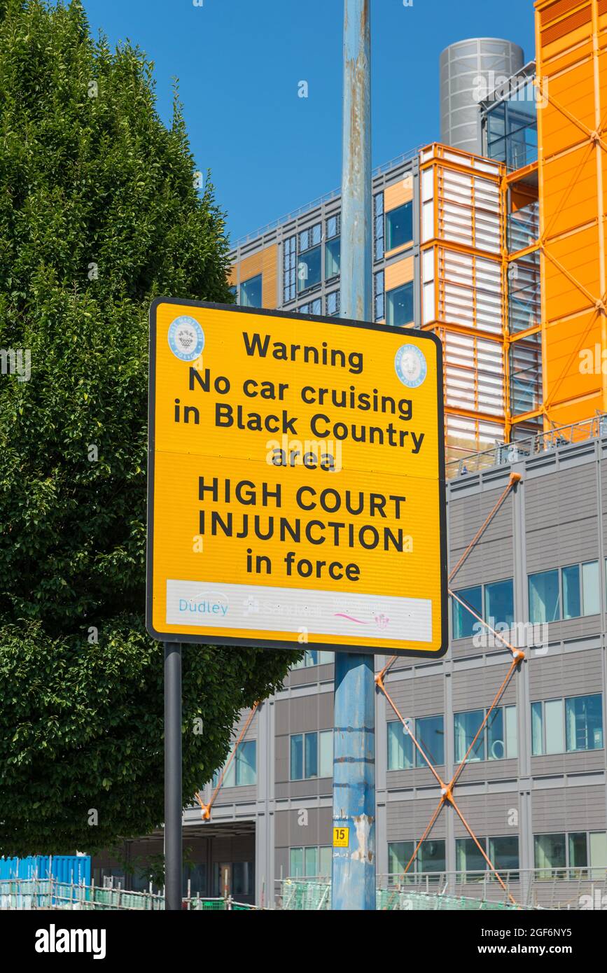 Large yellow road warning sign - no car cruising in Black Country area, high court injunction in place Stock Photo