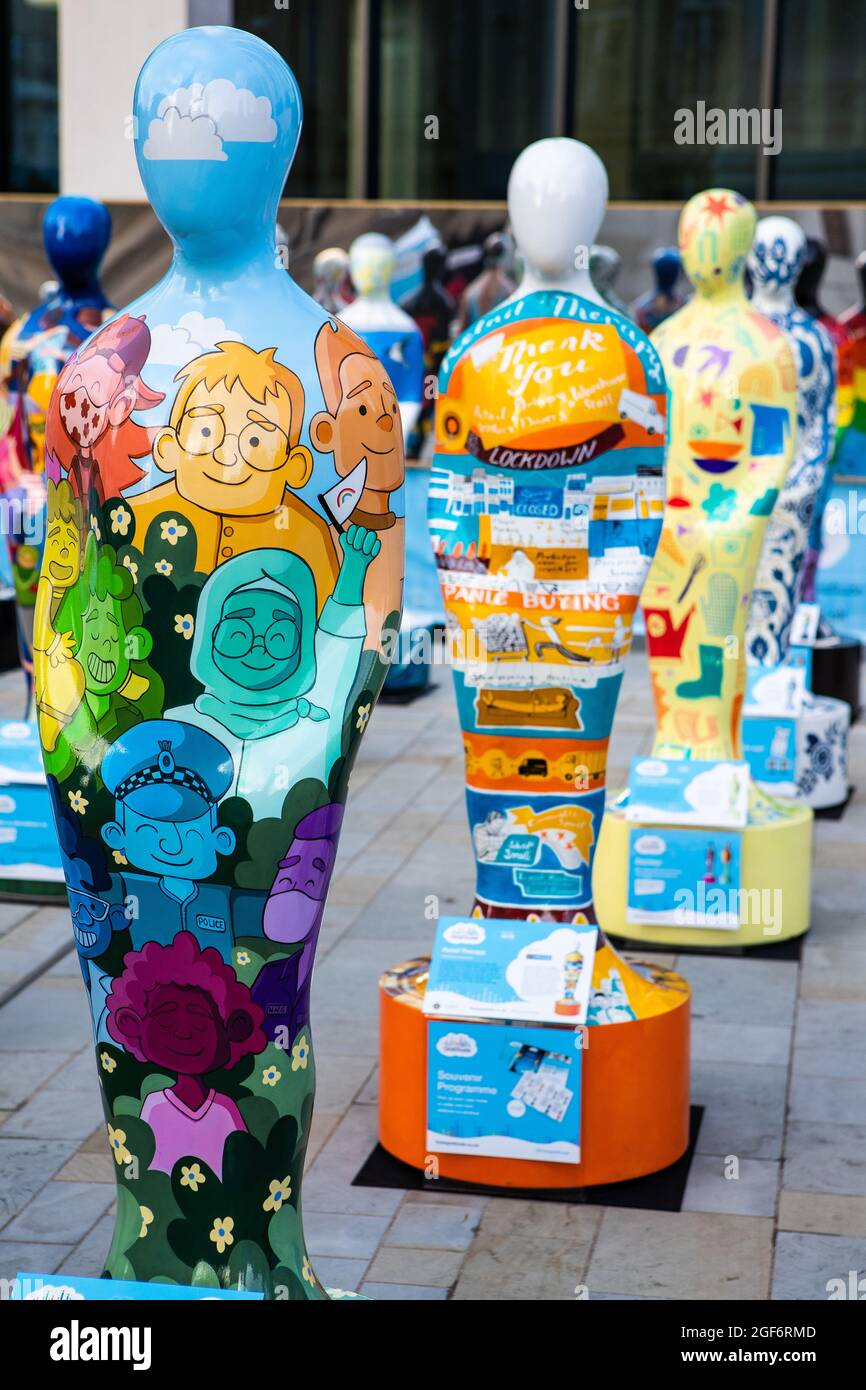 Birmingham, UK. 24th August, 2021. Gratitude is a public art installation by Wild In Art which celebrates the contributions made by NHS Staff and all key workers throughout the pandemic. The display of 49 characters opens in Chamberlain Square, Birmingham in August 2021 before touring to Manchester, Edinburgh and London. Each sculpture represents a unique human form and are individually designed by national and regional artists to reflect the stories and contributions of key workers. Credit: Anthony Wallbank/Alamy Live News Stock Photo