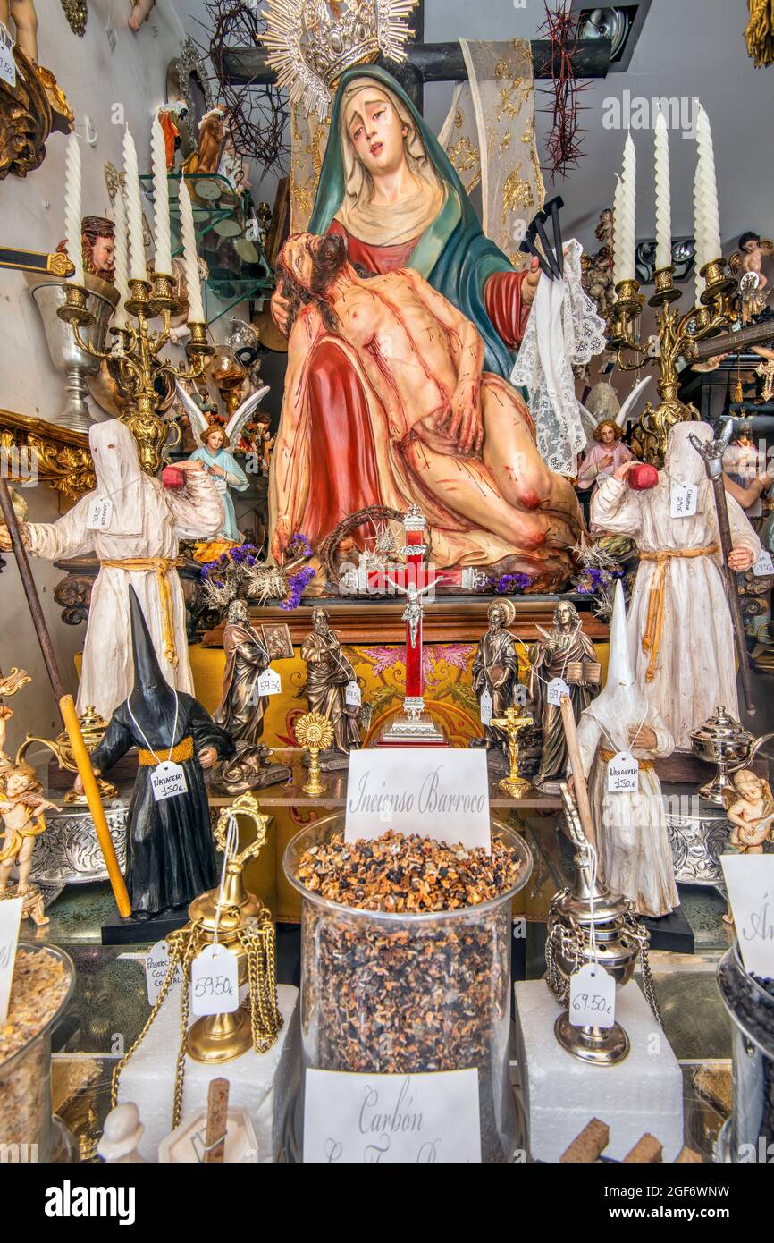 Window display of religious articles store, Cadiz, Andalusia, Spain Stock Photo