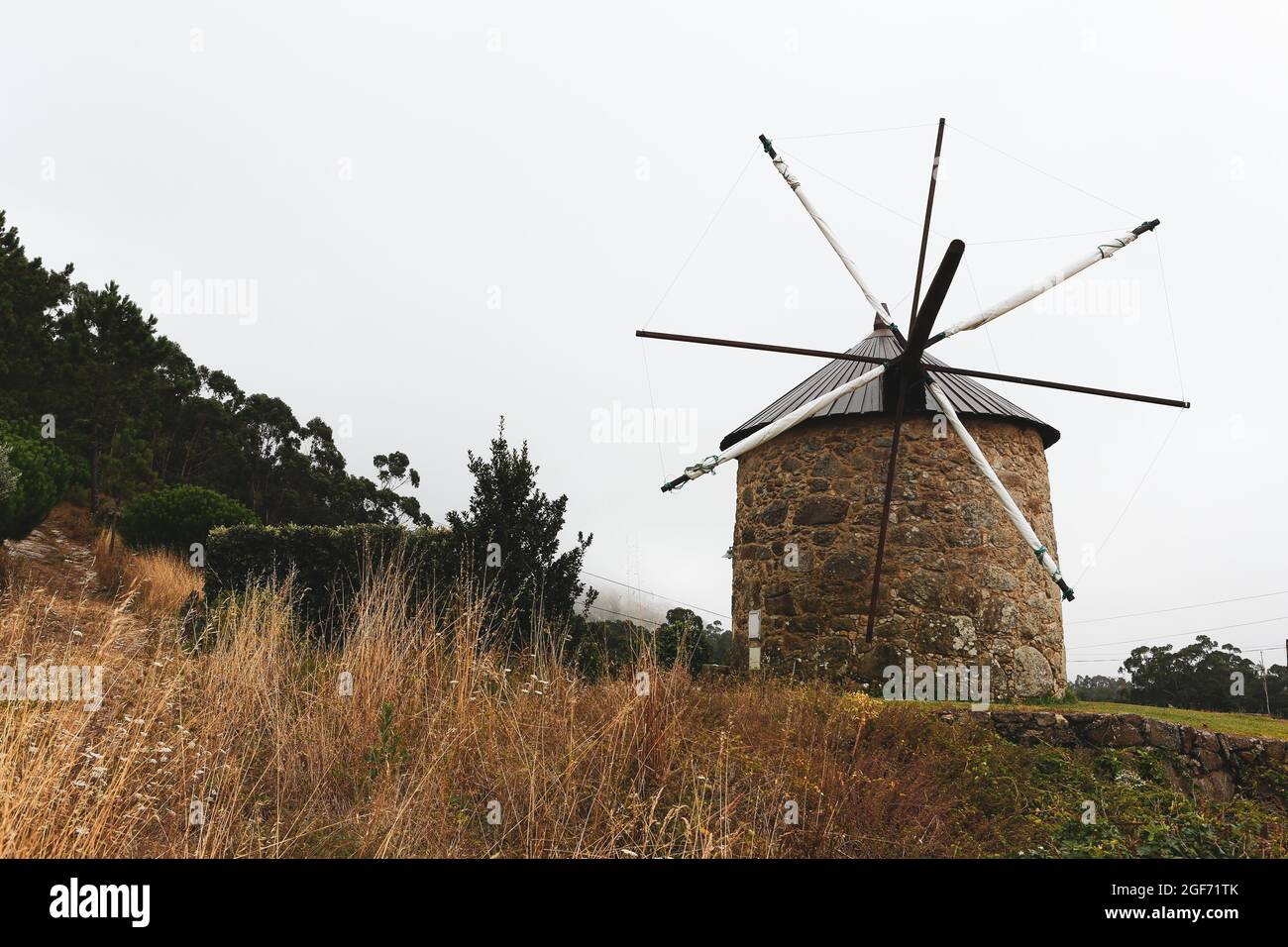 Scenic View Of A Stone House Mill In Farmland In The Countryside Stock scenic-view-of-a-stone-house-mill-in-farmland-in-the-countryside-stock