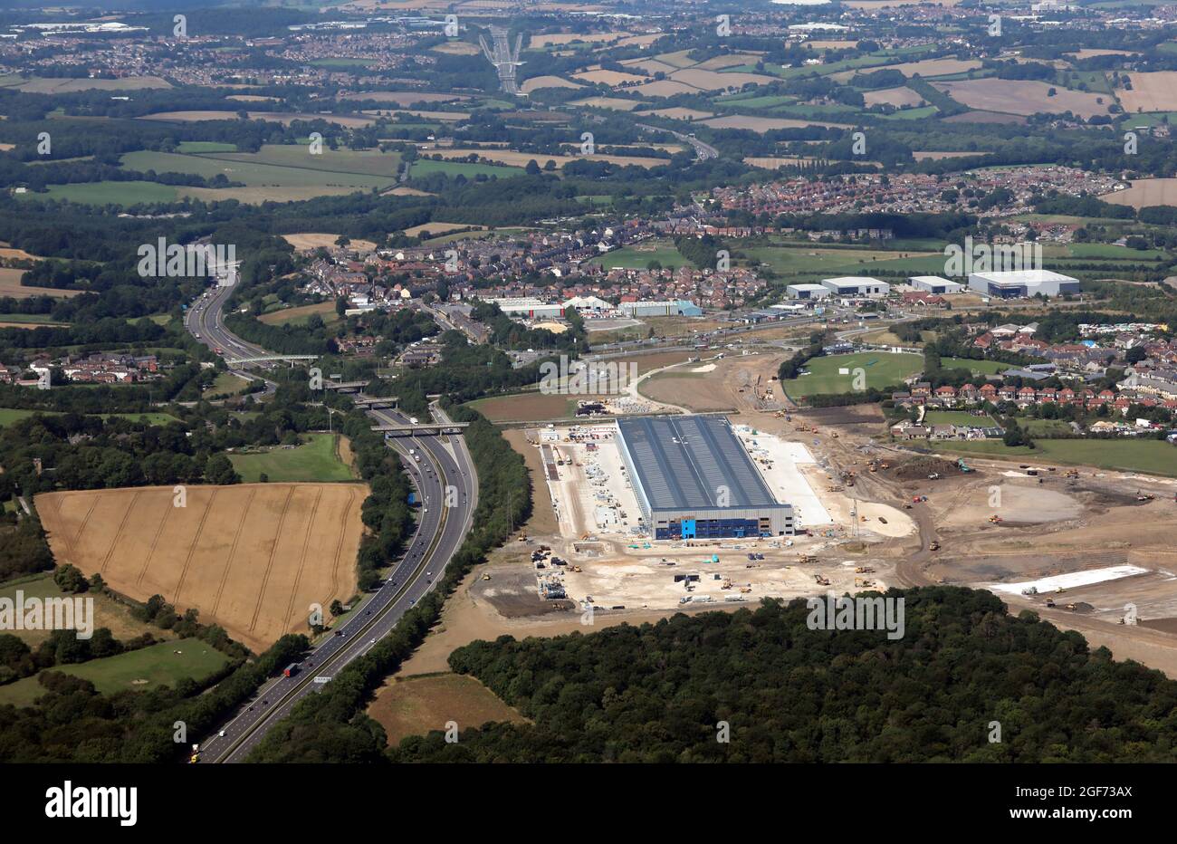 aerial view of a new logistics warehouse being being alongside the M1 at junction 36, Tankersley, Barnsley, South Yorkshire Stock Photo