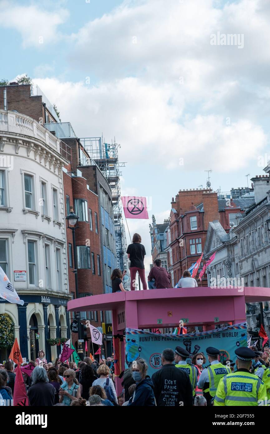 XR21 place an oversized Pink table in the middle of Long Acre Junction blocking off access to all its connecting roads on the junction and began an occ Stock Photo