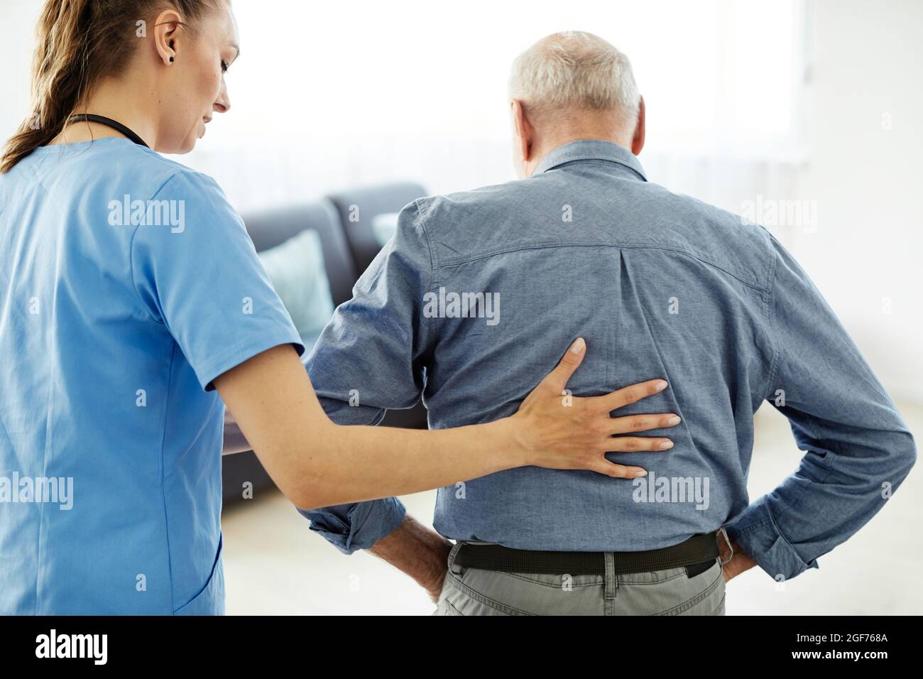 nurse doctor senior care caregiver help assistence retirement home hospital nursing elderly man Stock Photo