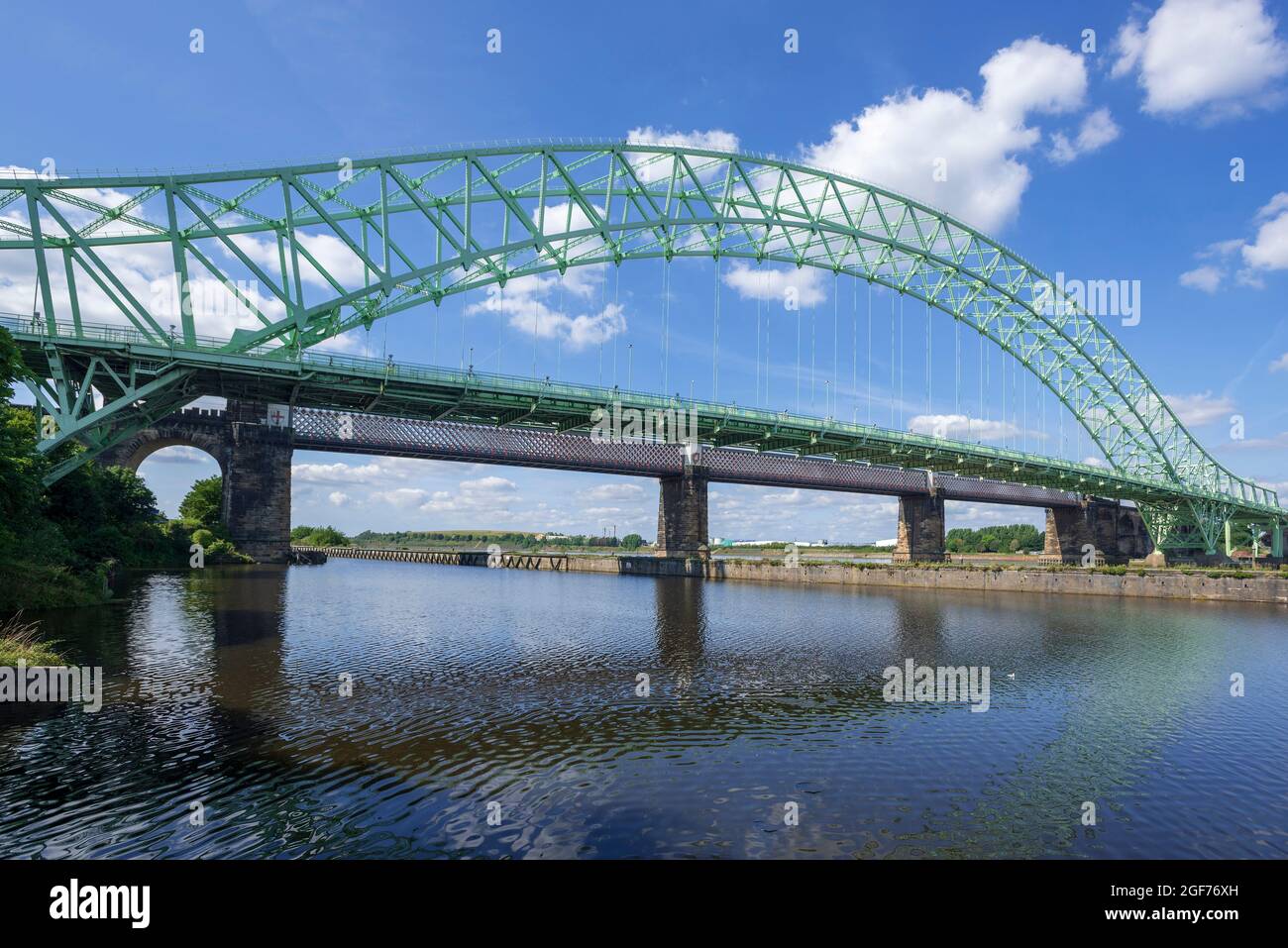 The Silver Jubilee or Queensway bridge crosses the River Mersey at Runcorn Gap between Runcorn and Widnes in Cheshire, England. It is alongside the Ru Stock Photo