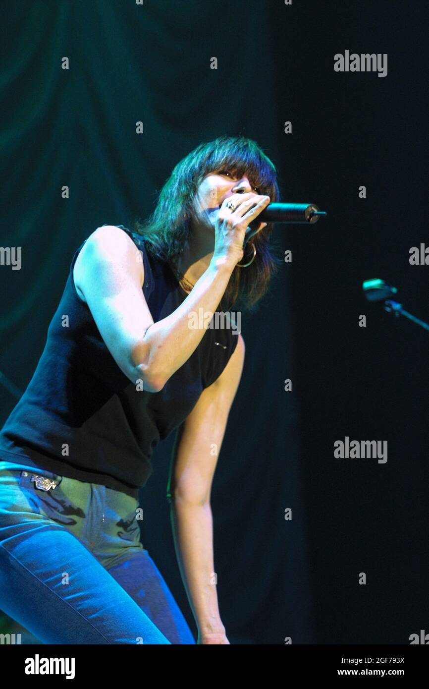 Chrissie Hynde, lead singer of The Pretenders, singing in concert at