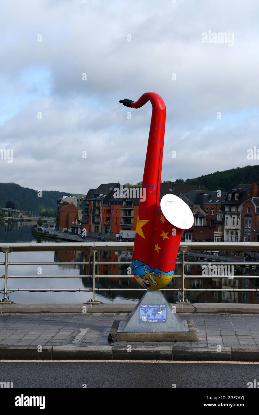 Colourful saxophone in memory of Adolphe Sax on the Pont du Charles de Gaulle, Dinant, Province, Namur, Belgium Stock Photo