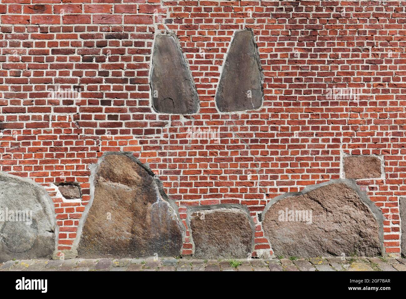 St. Severin, brick wall with walled-in gravestones, Keitum on Sylt, East Frisian Islands, Schleswig-Holstein, Germany Stock Photo