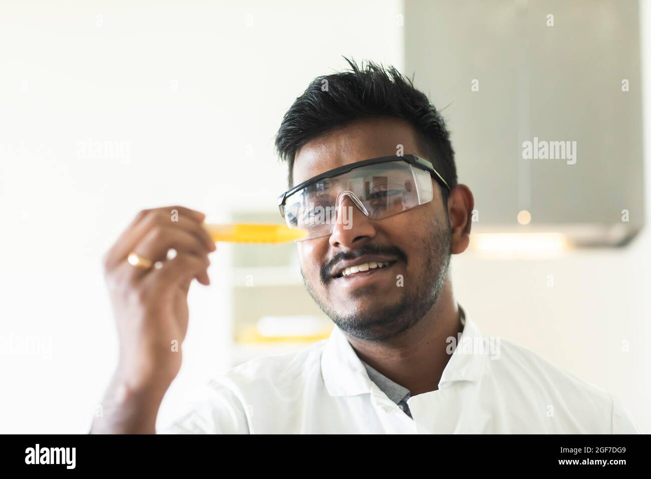 Student in an internship at the university with sample and lab coat, Freiburg, Baden-Wuerttemberg, Germany Stock Photo