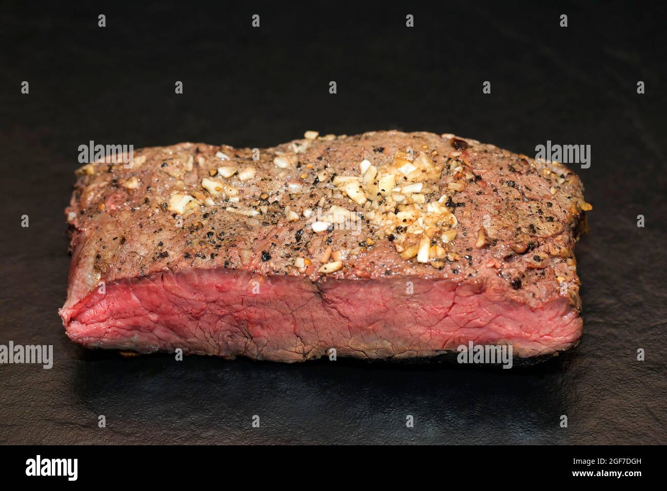 Medium roasted beef roast beef in pepper garlic coating Stock Photo Alamy