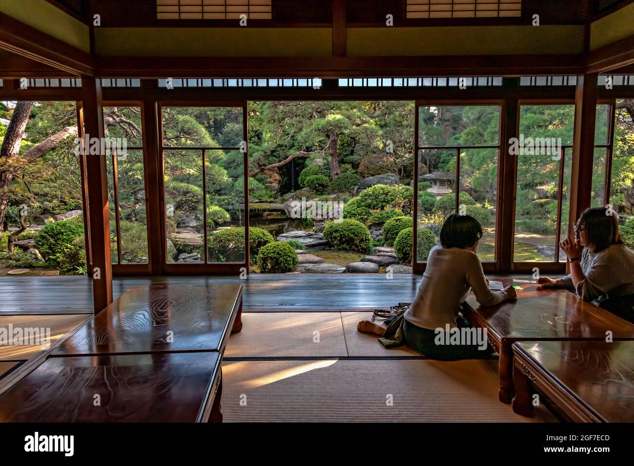 Two ladies in Shibamata tea house and traditional garden, Tokyo, Japan. Stock Photo