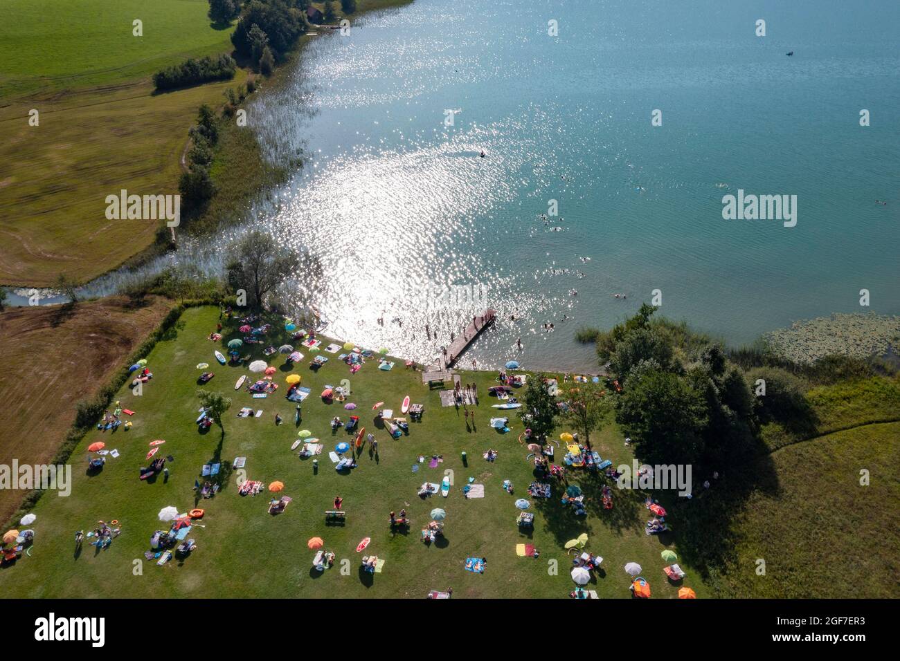 Drone shot, bathing place with colourful sunshades at the Irrsee, Zell am Moos am Irrsee, Salzkammergut, Upper Austria, Austria Stock Photo