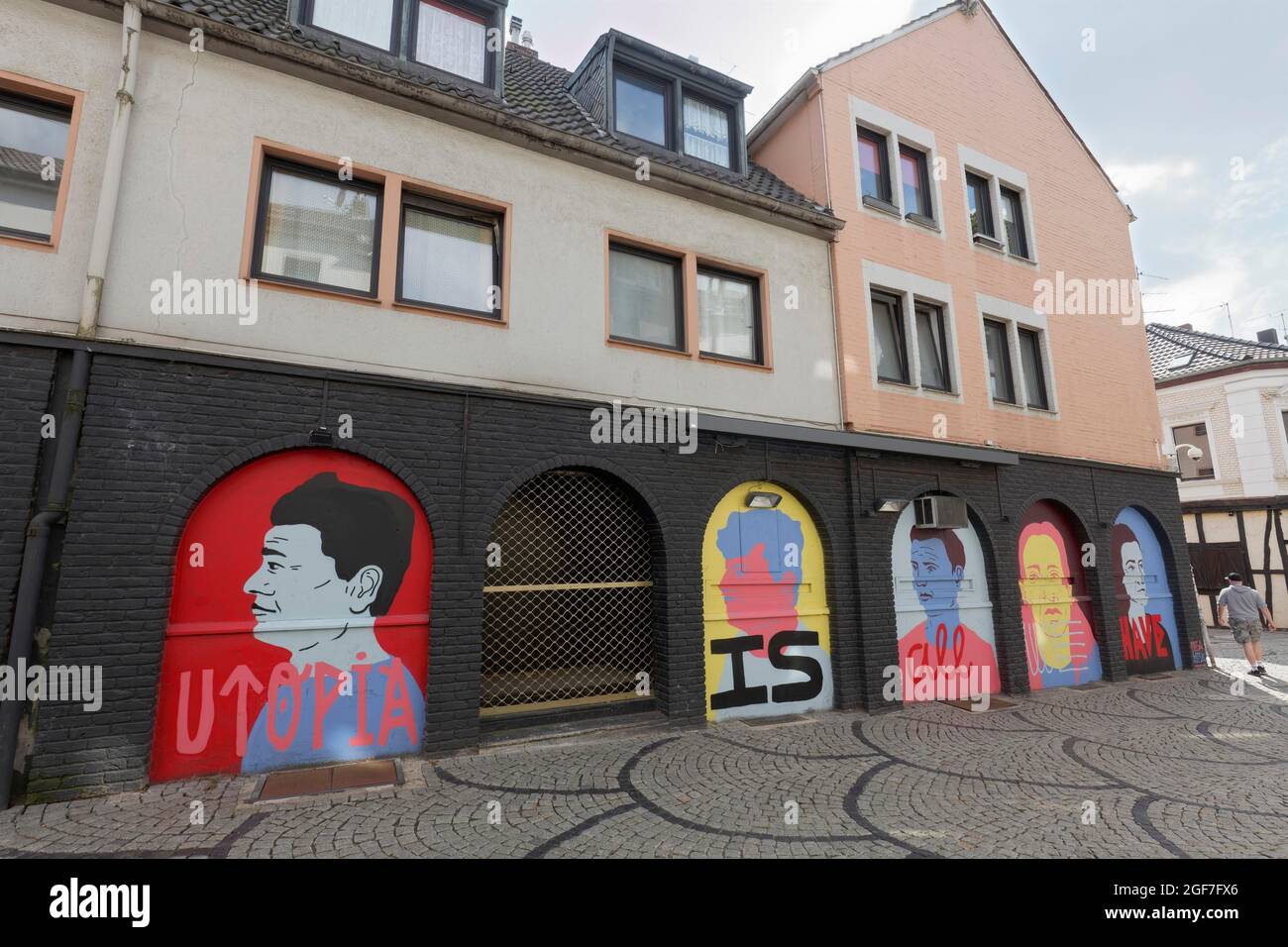 Utopia is all we have, painted facade of a pub, trendy Waldhausener Strasse district, Moechengladbach, North Rhine-Westphalia, Germany Stock Photo