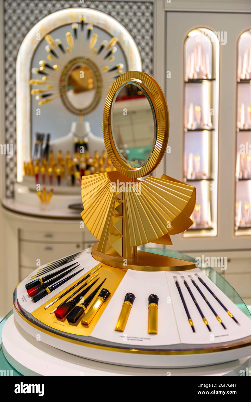 Golden mirror and makeup on a display, luxury department stores, Harrods, London, England