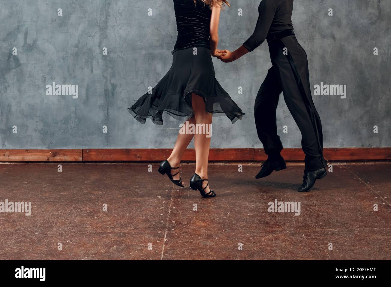 Young boy and girl dancing ballroom dance Jive. Stock Photo