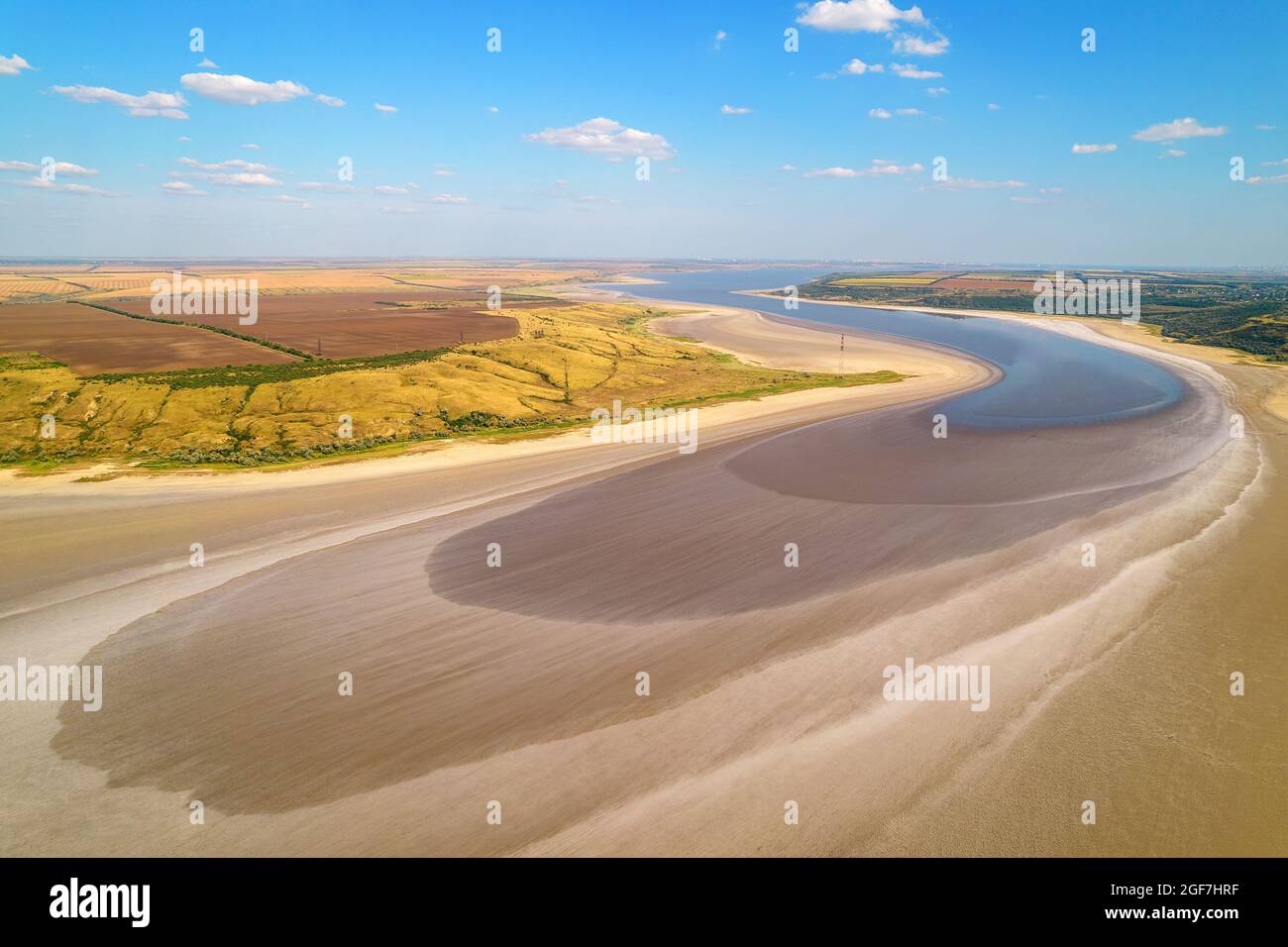 Amazing beauty of dried salty lake of light beige color surrounded by ...