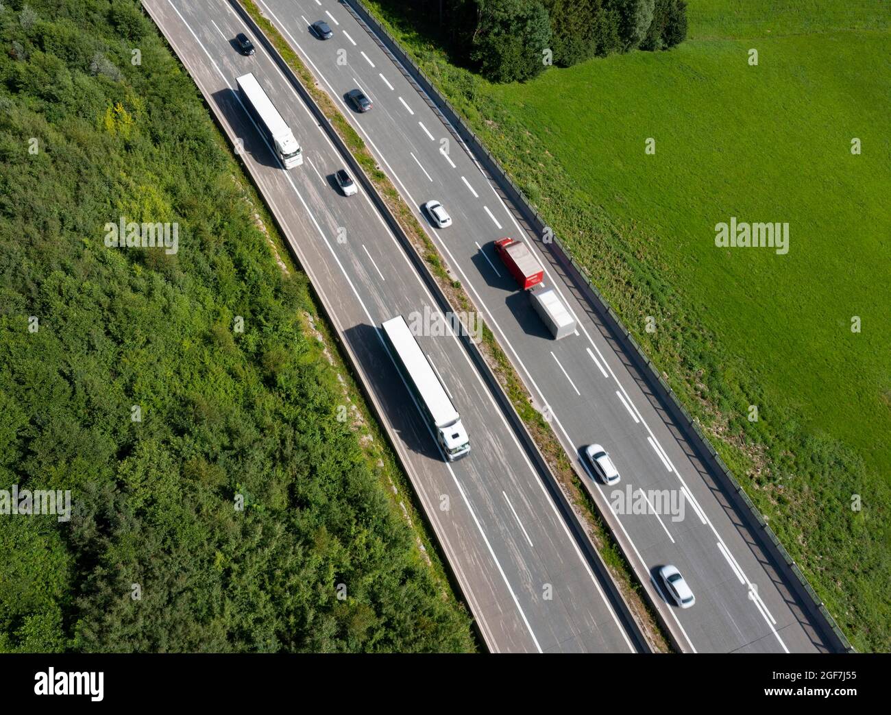 Drone shot, road traffic on the motorway from above, Westautobahn (A1) near Mondsee, Salzkammergut, Upper Austria, Austria Stock Photo