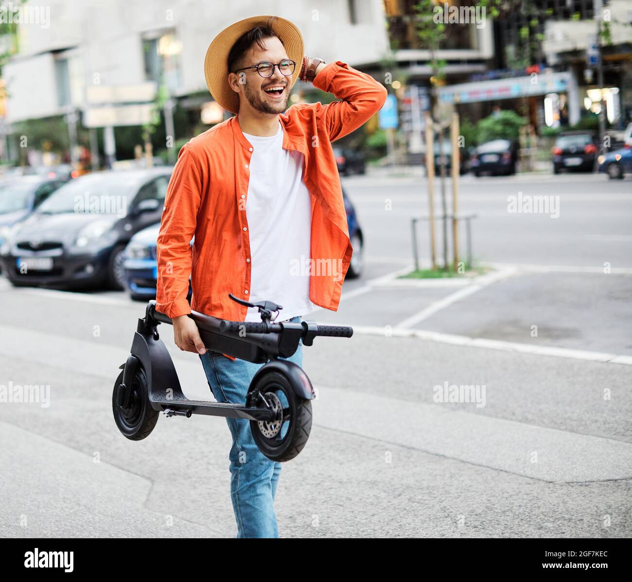Man riding electric scooter hi-res stock photography and images - Alamy