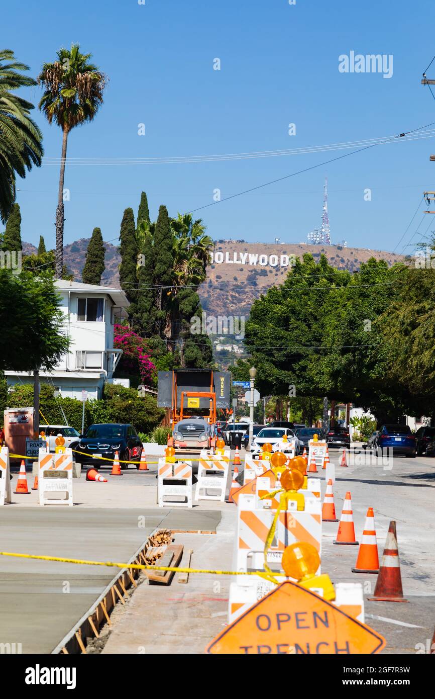 Hollywood sign above roadworks. North Beachwood Drive.  Los Angeles, California, United States of America. Stock Photo