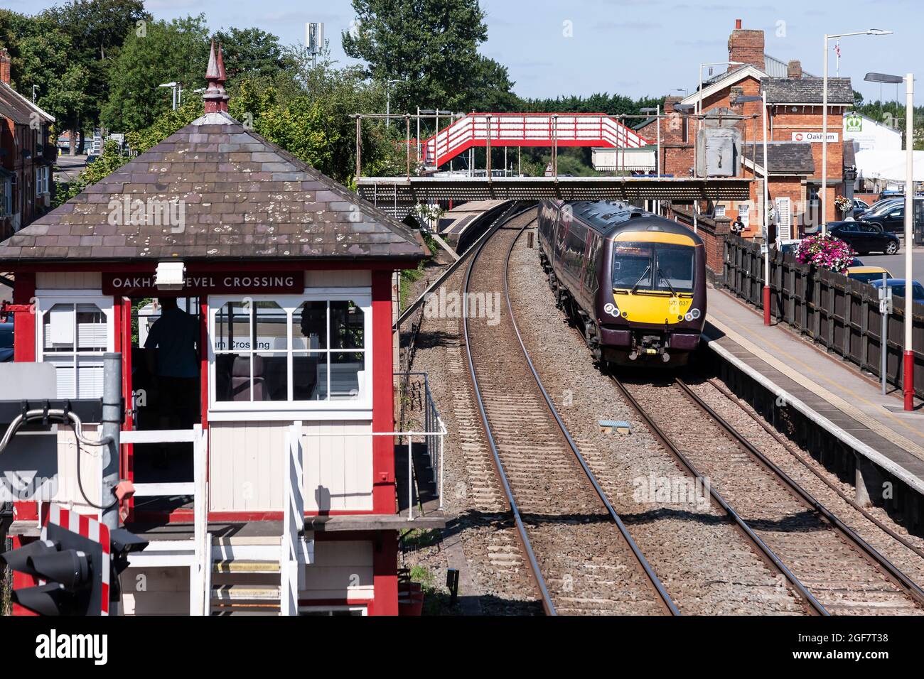 Train pulling out of Oakham station on a Monday afternoon, looking down