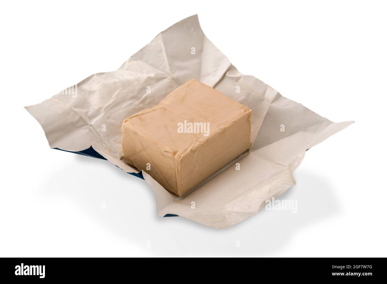 fresh yeast cube, brewer's yeast in paper isolated on white background Stock Photo