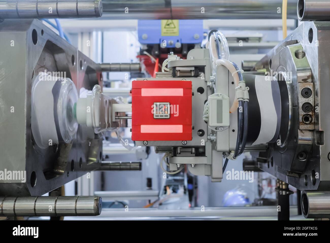 Injection molding machine during work: production of empty plastic ...