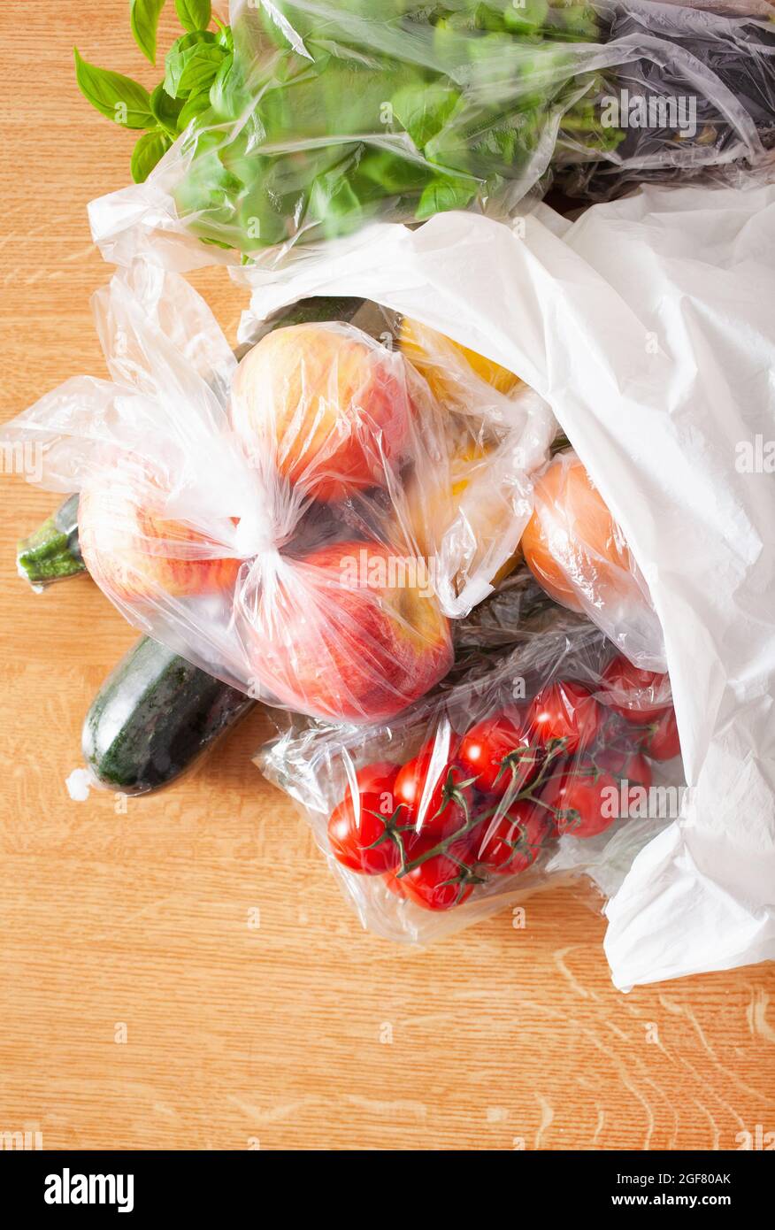 single use plastic waste issue. fruits and vegetables in plastic bags