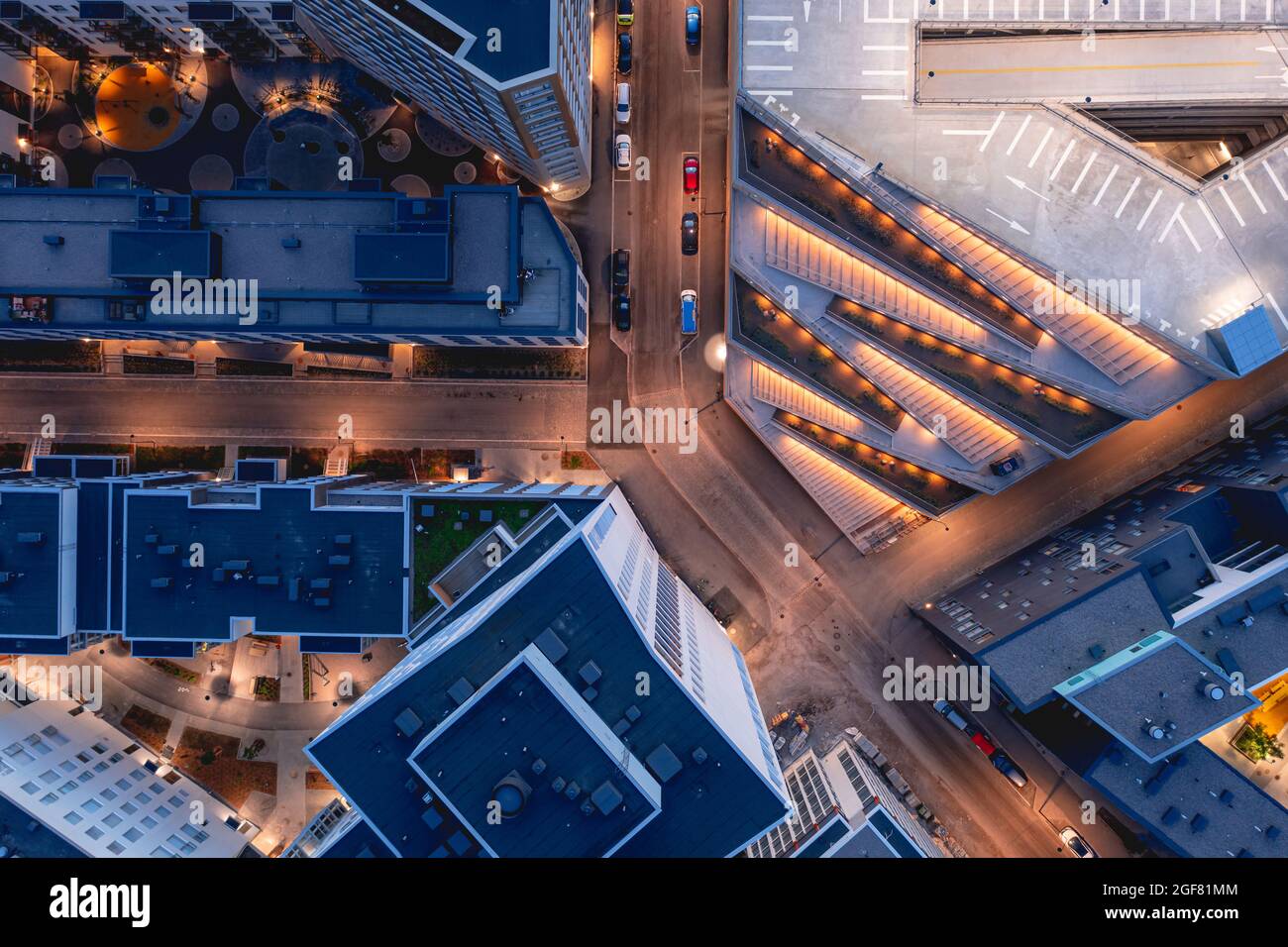 Aerial view of the modern apartment buildings and multilevel parking in ...