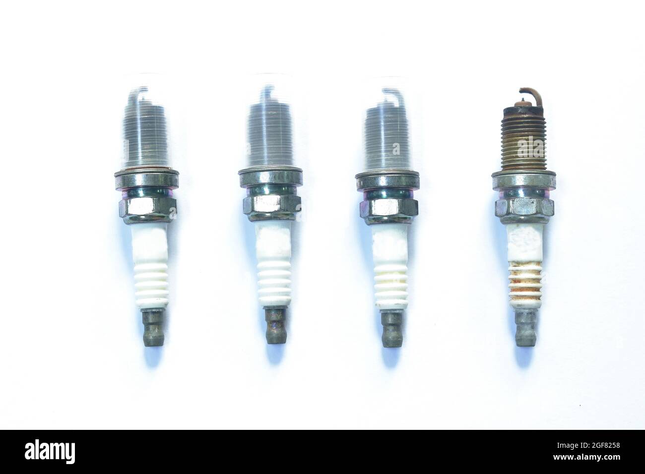 old car spark plug arranging on white background Stock Photo