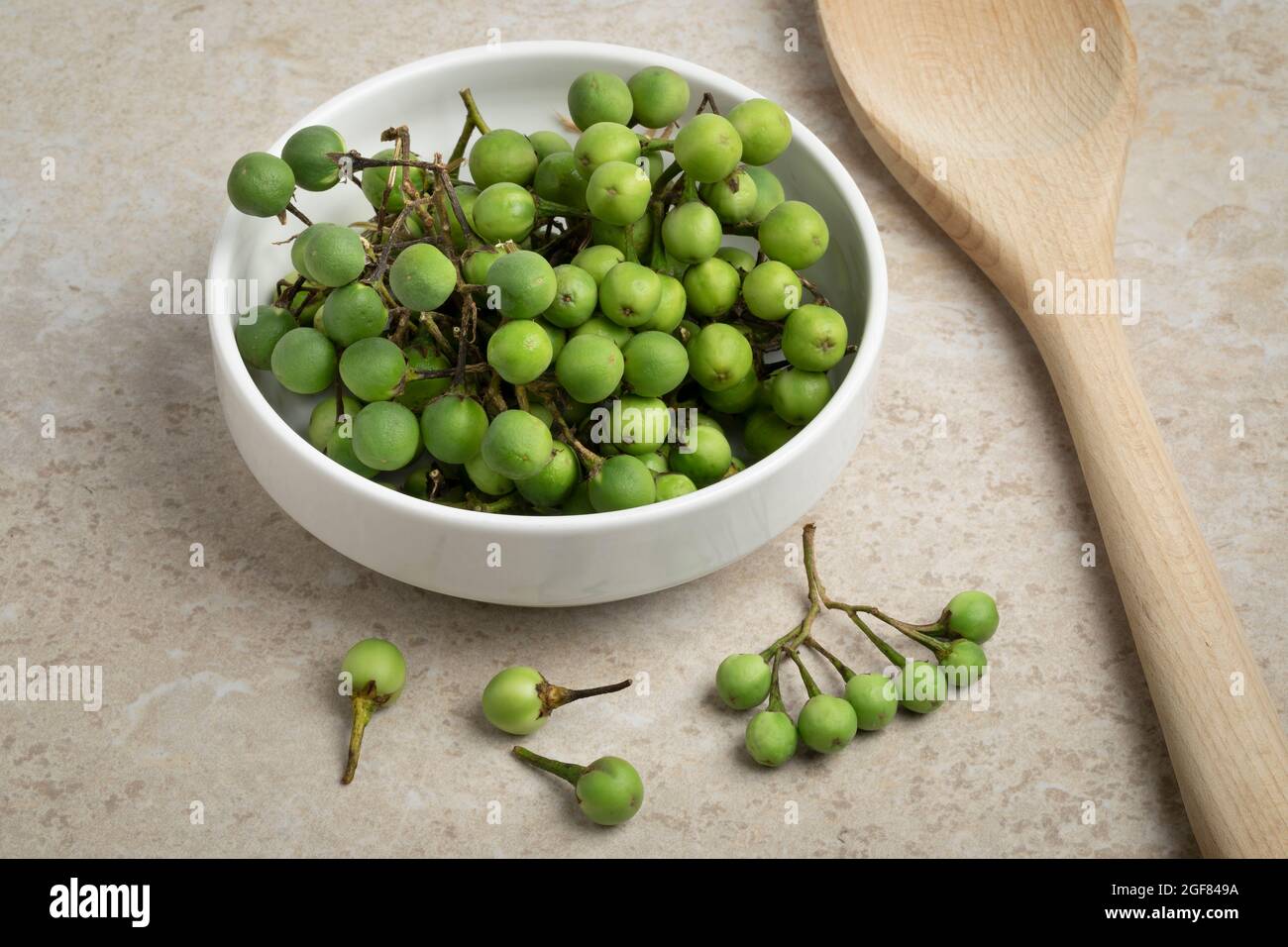 Bowl with green Thai eggplants close up Stock Photo